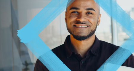 1. A smiling man is enclosed within a blue square, conveying a cheerful and positive atmosphere.