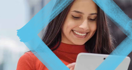 1. A woman smiles while holding a tablet computer, showcasing a positive and engaging interaction with technology.