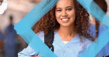 1. A smiling woman in scrubs holds a bag, conveying a sense of positivity and readiness in a healthcare setting.