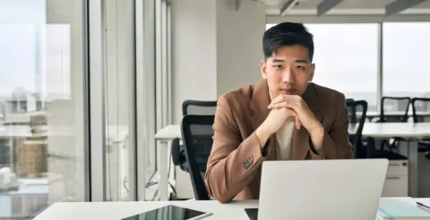 Aspiring business leader completing an online application form for an advanced MBA program.