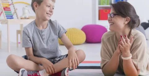 Empathetic school counsellor providing guidance to a student during a private, supportive consultation session.