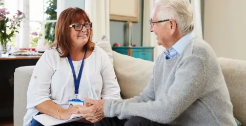 A professional portrait of an advocate sharing lived experience to improve mental health leadership.