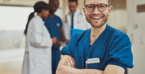 Nurse using digital technology to analyze patient data in a modern healthcare environment.