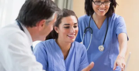 Group of nurses working together to rethink and improve the patient bedside care experience.